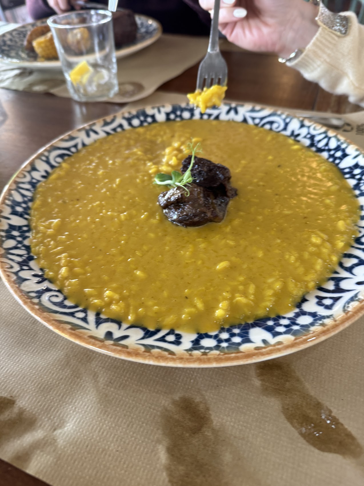 Saffron risotto with braised meat at Zena.